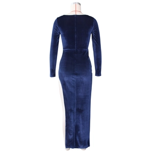Back view of a slim fit navy blue velvet dress featuring a high slit and long sleeves