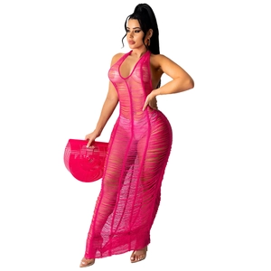Detail of rose red crochet knit beach cover-up dress with fringe and matching wood handbag