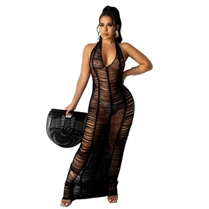 Close-up of black hollow-out knit dress showing deep V-neck and transparent texture