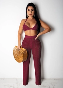 Close-up of burgundy knit two-piece set featuring halter top and crochet texture