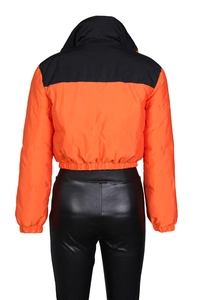 Rear view of cropped orange and black puffer jacket with elastic cuffs and PU pants