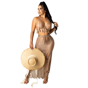 Women's summer khaki crochet two-piece beach set with tassel halter top and side slit maxi skirt