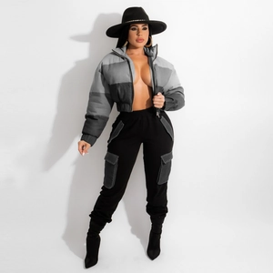 Women's color block jacket with gray patchwork and matching black cargo pants outfit