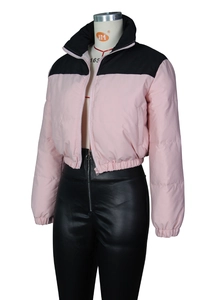 Detail of pink and black color block puffer jacket with stand collar and elastic cuffs
