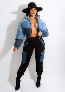 Detail of color-block patchwork denim jacket with cargo pants and drawstring waist