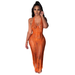 Detail of orange halter neck knitted maxi dress with fringe and sheer cutout design