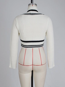 Detailed back view of a white cropped V-neck knit sweater featuring black stripe accents