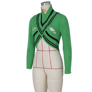 Detail of green V-neck knit sweater with black stripes on a mannequin display