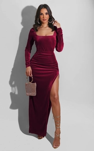 Close-up of elegant square neck burgundy velvet dress with side slit and waist pleats