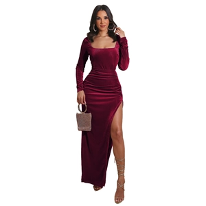 Detail of burgundy velvet evening dress featuring elegant square neck and high side slit design