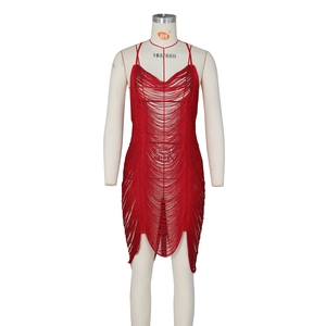 Detailed view of red fringe tassels and woven texture on a sexy cutout club dress