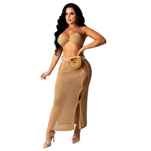 Women's two-piece crochet knit beach set with halter bikini top and side slit maxi skirt