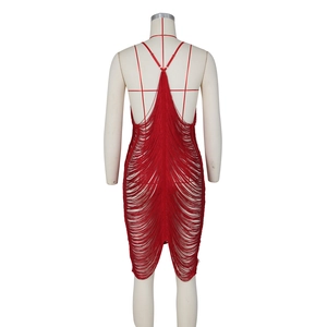 Detail of red backless bodycon dress featuring dense fringe tiers and thin straps