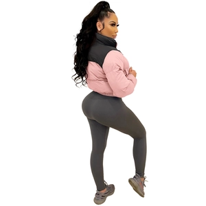 Detail of pink and black color block puffer jacket with high waist ribbed slim pants