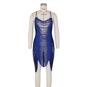 Detail of blue fringe bodycon dress showing the intricate tassels and hollow-out texture