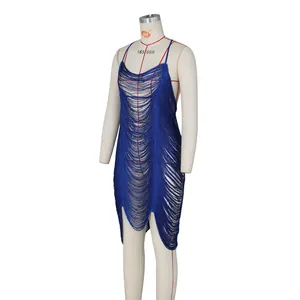 Detailed view of deep blue tassel dress on mannequin with hollow fringe and thin straps