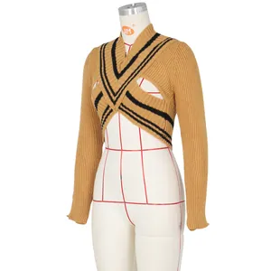 Detail of cropped V-neck mustard knit sweater with black stripes and hollow cut-out