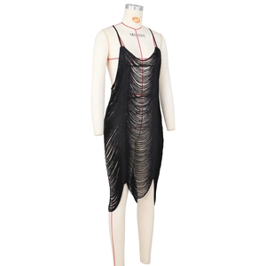 Detailed view of black fringe dress with thin straps and sheer tassel texture