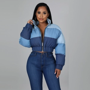 Women's cropped denim puffer jacket with color-block gradient and high-waisted jeans