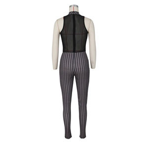 Detail of sheer black mesh back and houndstooth pattern on fitted sleeveless jumpsuit