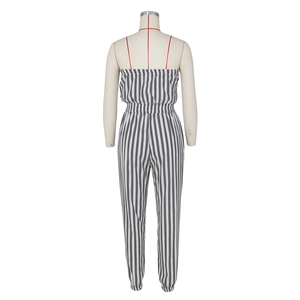 Detailed back view of striped strapless jumpsuit with thin red straps and elastic waist