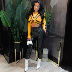 Close-up of yellow ribbed knit crop top featuring a sexy hollow-out chest design