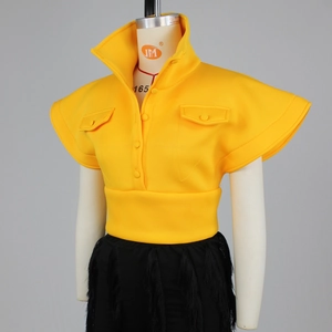 Detail of structured yellow sleeveless top featuring high neck and sharp cap sleeves