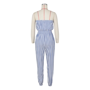Detail of blue and white striped strapless jumpsuit with red decorative drawstrings