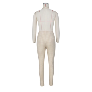 Detail view of the back zipper and houndstooth pattern on a sleeveless jumpsuit