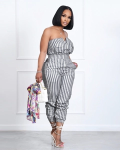 Detail of grey striped tube jumpsuit showing zip closure and chest flap pockets