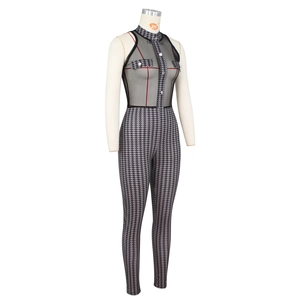 Detail of sleeveless jumpsuit featuring houndstooth pattern and black mesh splicing