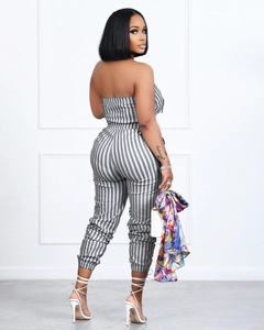 Detailed view of the vertical striped strapless jumpsuit with slim fit tailoring