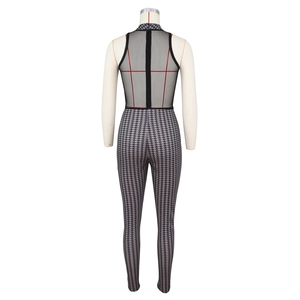 Detail of high-neck sleeveless bodysuit featuring black mesh and houndstooth pattern