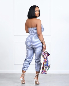 Detail of blue and white vertical striped strapless jumpsuit with tapered leg cuffs