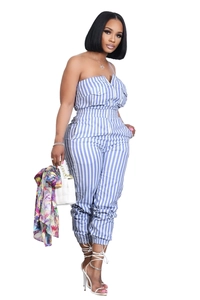 Detail of blue and white striped strapless jumpsuit featuring zipper and utility pockets