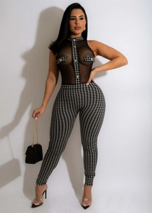 Detail of sheer mesh top with houndstooth pockets and sparkling rhinestone buttons