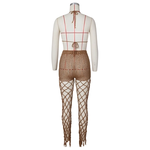 Detail of brown crochet halter top and hollow out fishnet pants with tassel hem