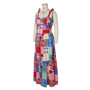 Detail of colorful patchwork plaid crop top and layered maxi skirt two-piece set