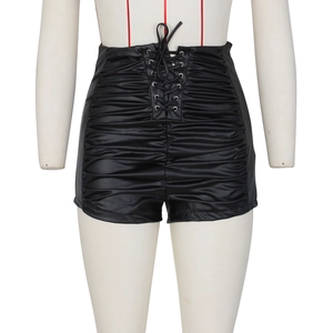 Detailed view of high waist PU leather shorts with cross-lace front and ruched texture