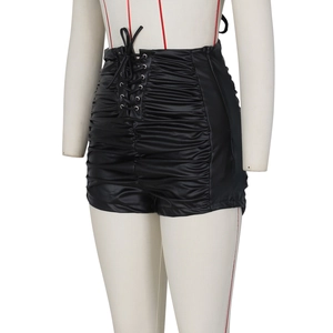 Detail of high waist black PU leather shorts with side ruching and lace-up drawstring