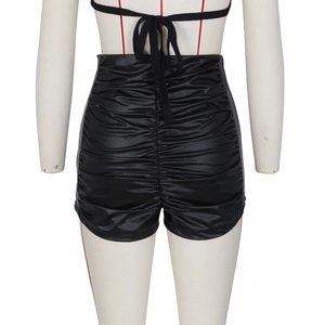 Detailed back view of high waisted ruched black PU leather shorts with satin finish