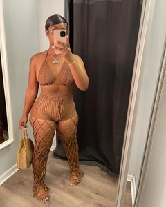 Three-piece brown crochet set featuring hollow beach mesh pants and fringed knit shorts