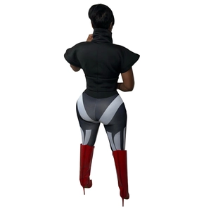 Rear view of fashion outfit featuring high collar black top and geometric pattern leggings