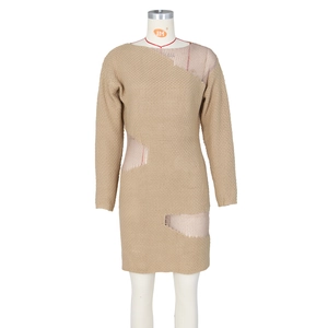 Detail of beige knit dress with unique cutout textures and distressed hem design