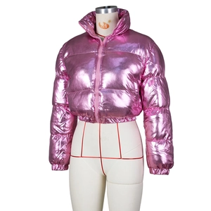 Macro detail of metallic pink cropped puffer jacket with shiny quilted fabric and high collar