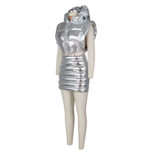 Detail view of metallic silver puffer vest and quilted mini skirt set on a mannequin