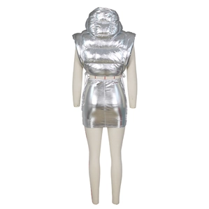 Macro shot of silver metallic hooded puffer vest and mini skirt set with glossy finish