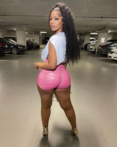 Detail showing pink faux leather high waist shorts with ruched butt lifting design