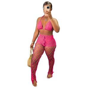 Detailed view of hot pink crochet 3-piece beach set with halter top and mesh pants