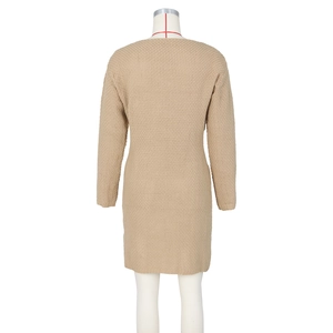 Back view of a beige knitted dress showing a slim fit silhouette on a white mannequin